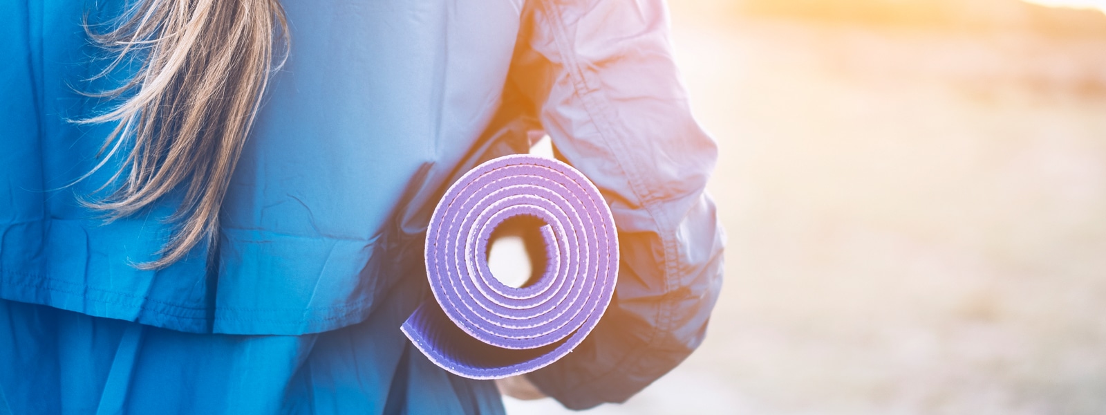 closeup of a yoga mat that a woman is holding