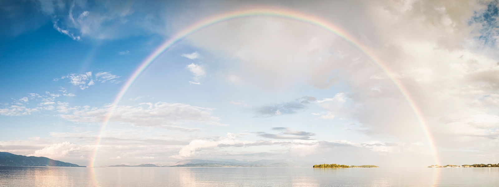 a rainbow over a body of water