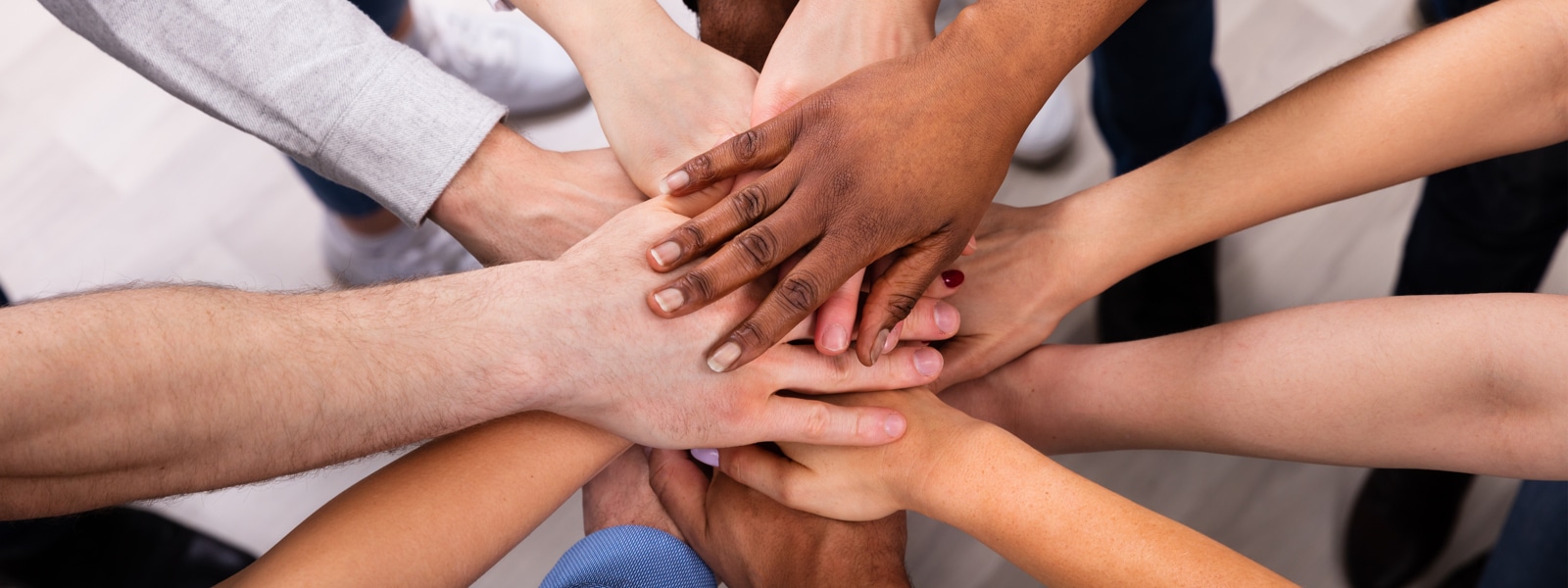 Hands of a diverse group of people