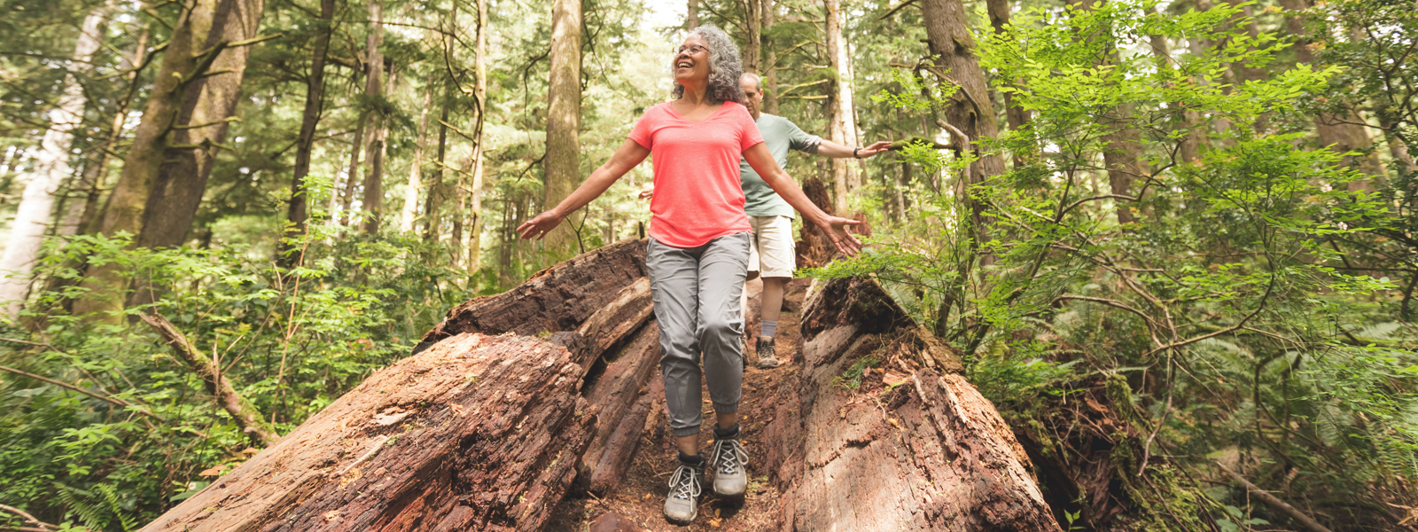 Man and Woman Walking in Forest