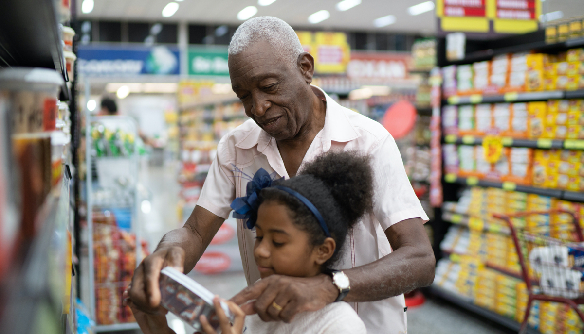 older man and younger girl in grocery store