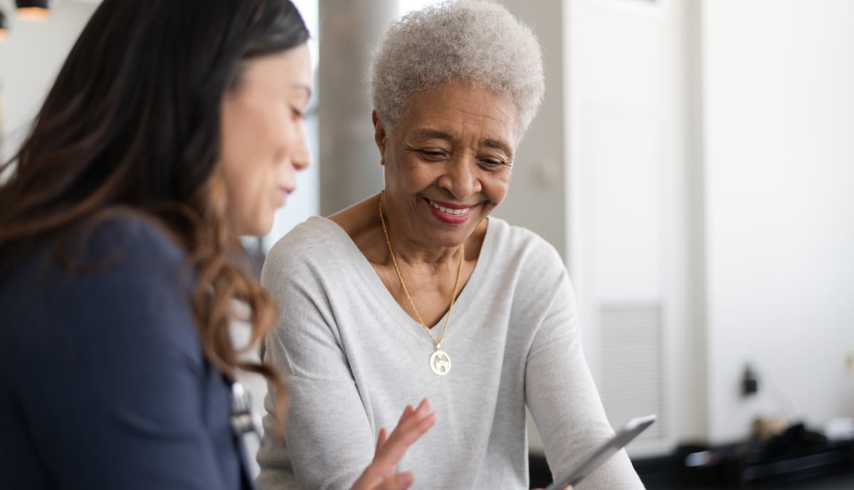 Older woman talking to younger woman
