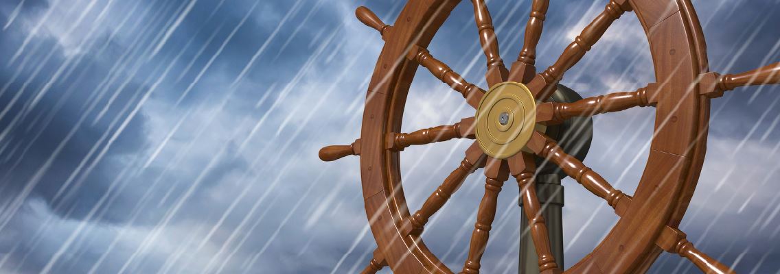 graphic of ships' wheel in a rain storm